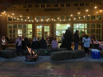 Evening outdoor event at Lincoln Log Cabin